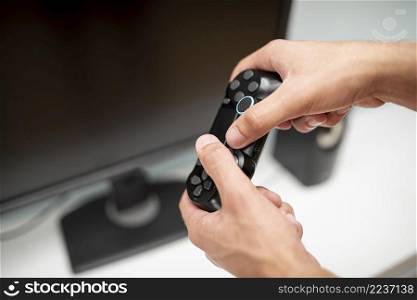 close up guy holding controller