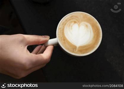 close up hand coffee cup