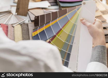 close up hand holding color palette. High resolution photo. close up hand holding color palette. High quality photo