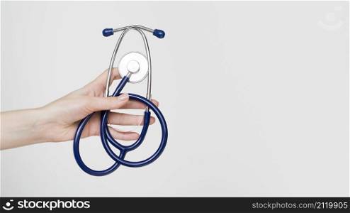 close up hand holding stethoscope