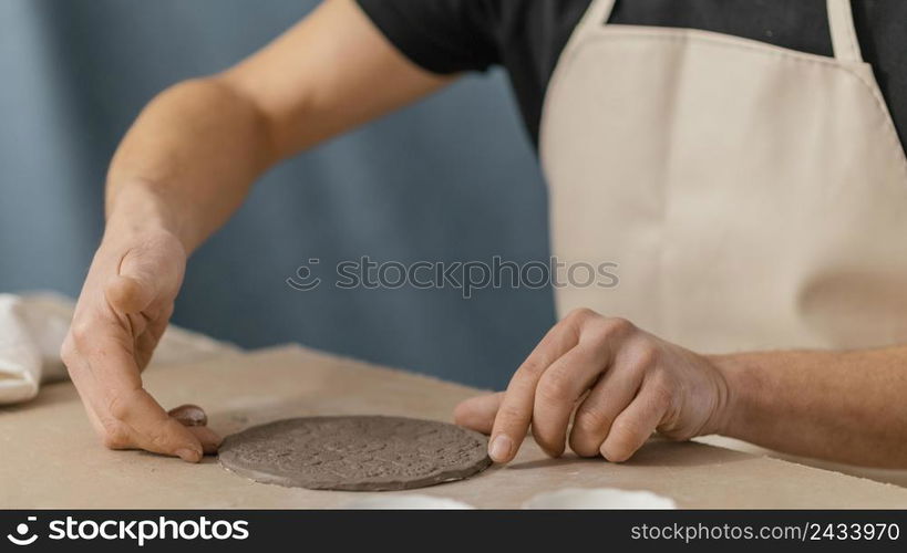 close up hand making plate