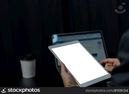 Close up hand man holding tablet blank white screen mock up on desk.