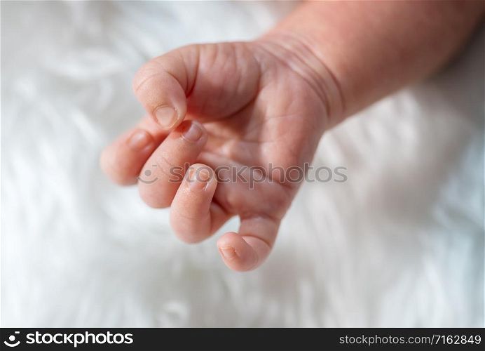 close up hand of newborn baby