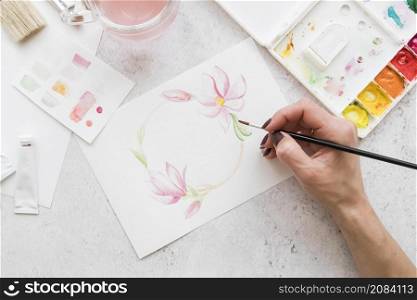 close up hand painting flowers