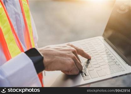 Close up hand touch on laptop keyboard technology