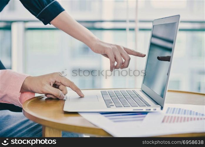 Close up hand touching a laptop in business concept with copy sp. Close up hand touching a laptop in business concept with copy space. Close up hand touching a laptop in business concept with copy space