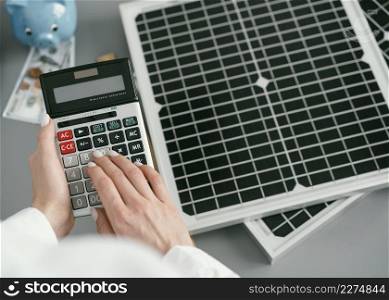 close up hand typing calculator