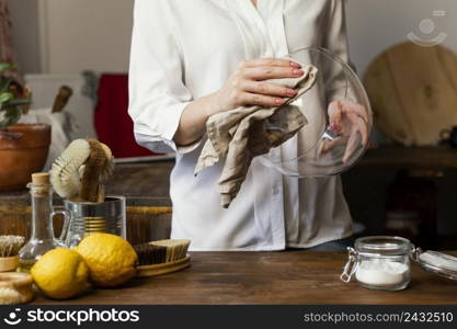 close up hands cleaning bowl