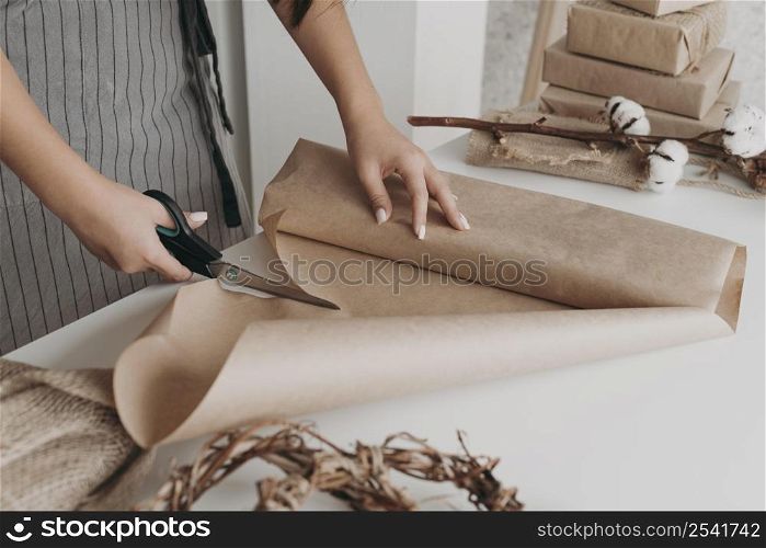 close up hands cutting paper
