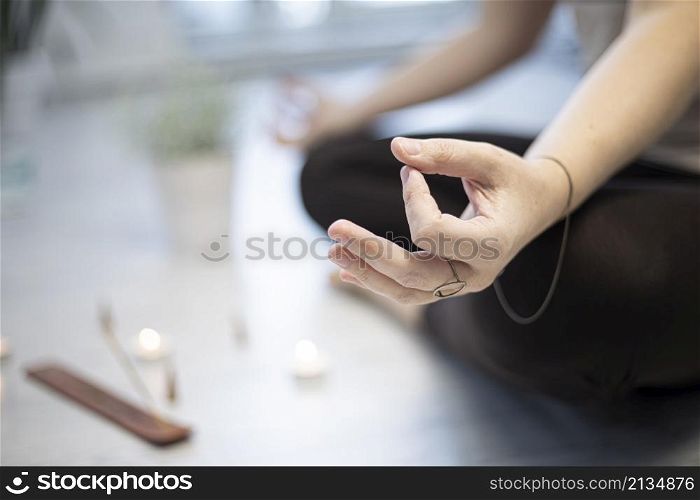 Close up hands. girl training in yoga studio. Healthy and Yoga Concept