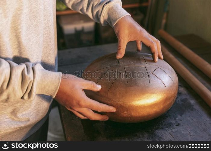 close up hands holding beautiful artisan item