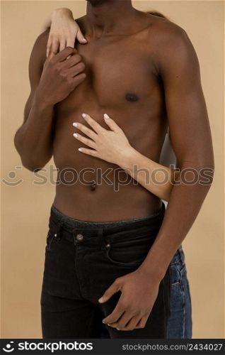 close up hands holding black man