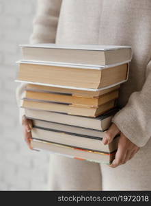 close up hands holding books stack. High resolution photo. close up hands holding books stack. High quality photo