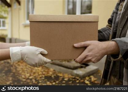 close up hands holding box