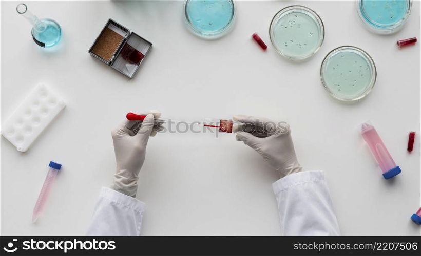 close up hands holding pipette