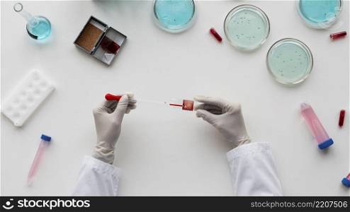 close up hands holding pipette