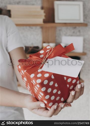 close up hands holding present