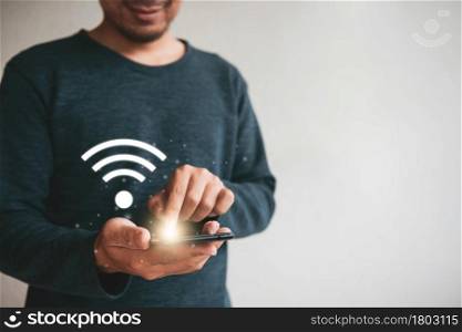 Close up hands holding smartphone. man using cellphone connecting wifi for marketing and searching data and social media on internet.technology business investment concept
