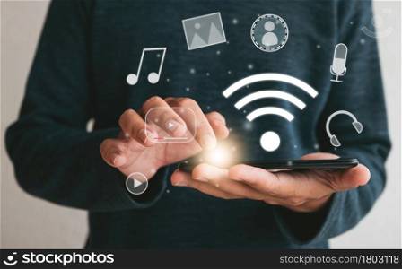 Close up hands holding smartphone. man using cellphone connecting wifi for marketing and searching data and social media on internet.technology business investment concept