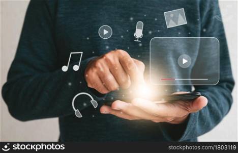 Close up hands holding smartphone. man using cellphone for streaming online watching video on internet live concert show or tutorial.technology business investment and education concept