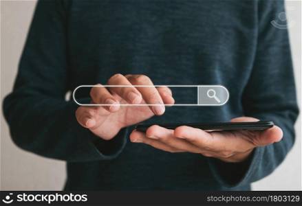 Close up hands holding smartphone. man working with smart phone and with blank search bar. Searching Browsing Internet Data Information Networking Concept
