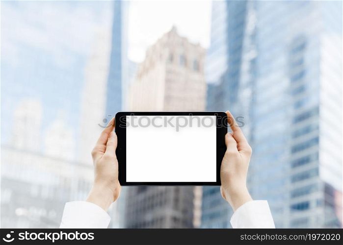 close up hands holding tablet mock up. High resolution photo. close up hands holding tablet mock up. High quality photo