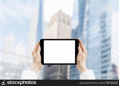 close up hands holding tablet mock up. High resolution photo. close up hands holding tablet mock up. High quality photo