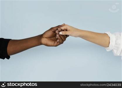 close up hands holding with blue background