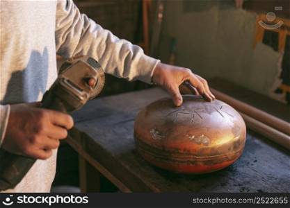 close up hands making artisan item