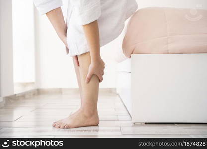 close up hands massaging legs