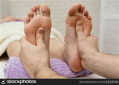 close up hands massaging soles