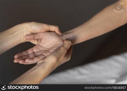 close up hands massaging wrist. Beautiful photo. close up hands massaging wrist