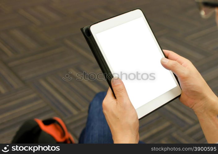 Close up hands multitasking man using tablet