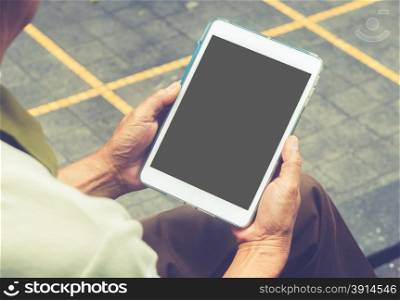 Close up hands multitasking man using tablet.vintage effect style pictures