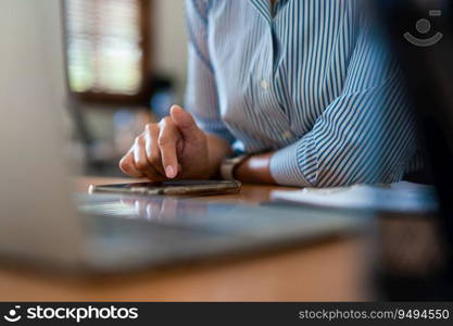 Close up hands of businessman use smartphone to searching business data or chatting with colleague.