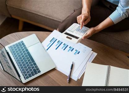 Close up hands of businesswoman is working to using calculator to calculate financial of business.