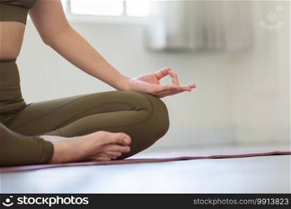 Close up hands of woman doing yoga lotus pose at in the morning to meditation and relax balance for good health,Healthy Concept