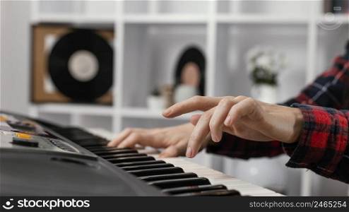 close up hands playing digitalπano