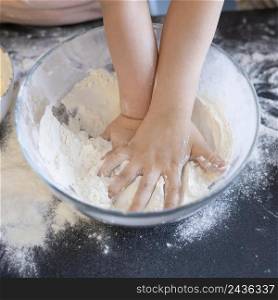 close up hands pressing flour