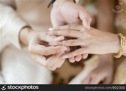 Close up hands Thai Bride and Groom