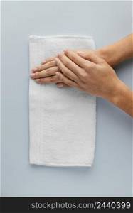 close up hands towel top view