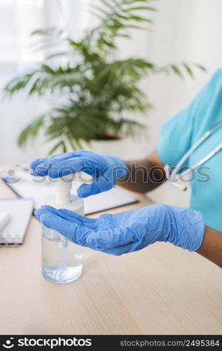 close up hands using disinfectant