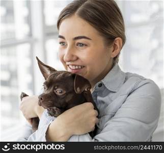 close up happy girl holding dog