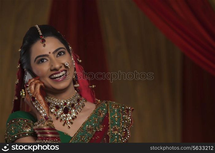 Close up happy young bride talking on cell phone