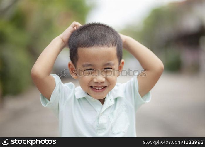 close up headshot of asian children laughing with happiness face