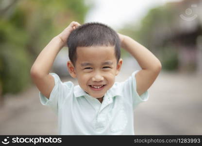 close up headshot of asian children laughing with happiness face