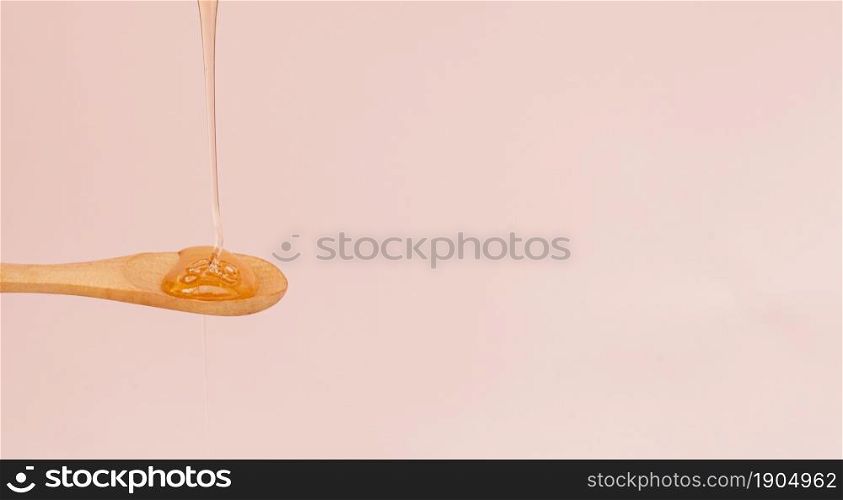 close up honey pouring spoon. Beautiful photo. close up honey pouring spoon