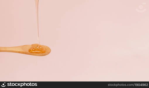 close up honey pouring spoon. Beautiful photo. close up honey pouring spoon