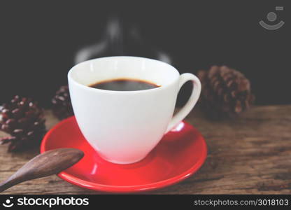 Close up hot coffee on rustic wooden table with retro filter, Vintage lifestyle