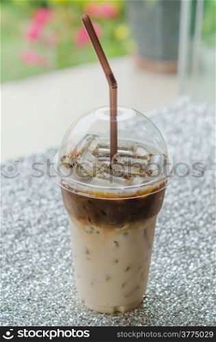 close up Iced coffee with straw in plastic cup. Iced coffee with straw